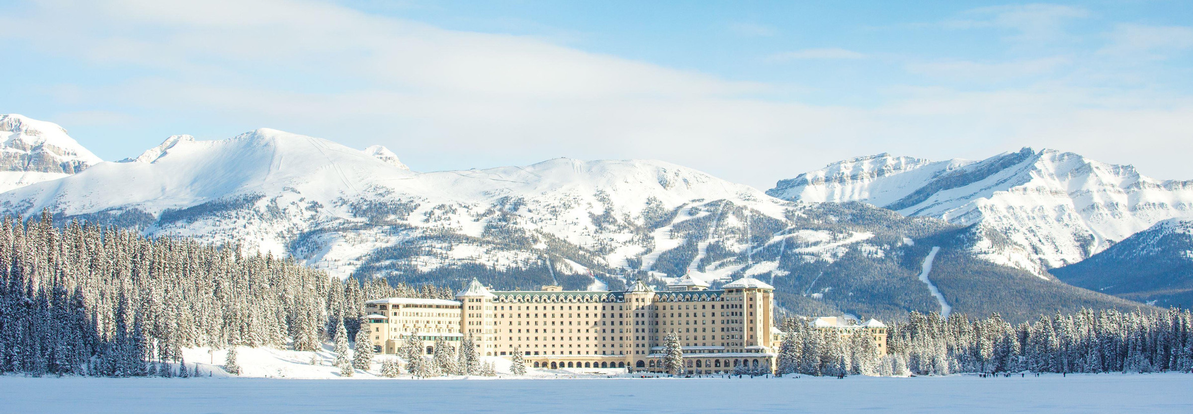 https://www.this-is-canada.com/wp-content/uploads/2023/11/Fairmont_Chateau_Lake_Louise_Winter_1024717_high_Microsite_-_TIC_-_Header_2400x834.jpg