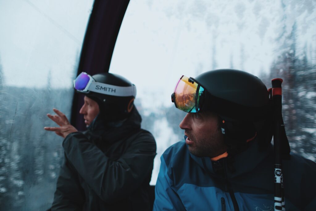 Two men looking out of the Sunshine Village Gondola in Banff