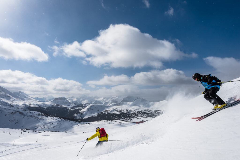 Two skiers heading down the mountain Banff Sunshine Village in Banff 