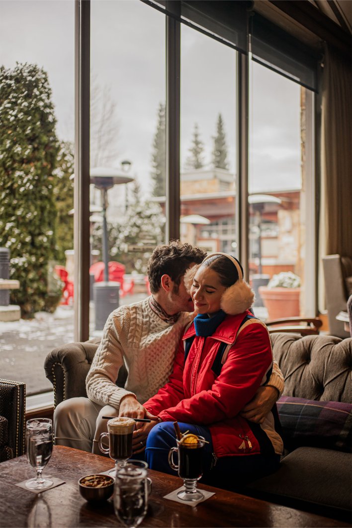 Couple cuddled up at Fairmont Chateau Whistler