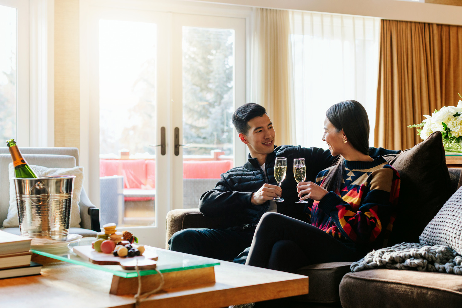 Couple Champagne - Stanley Thompson Cabin (1) (1) A couple with champagne and treats at Jasper Park Lodge
