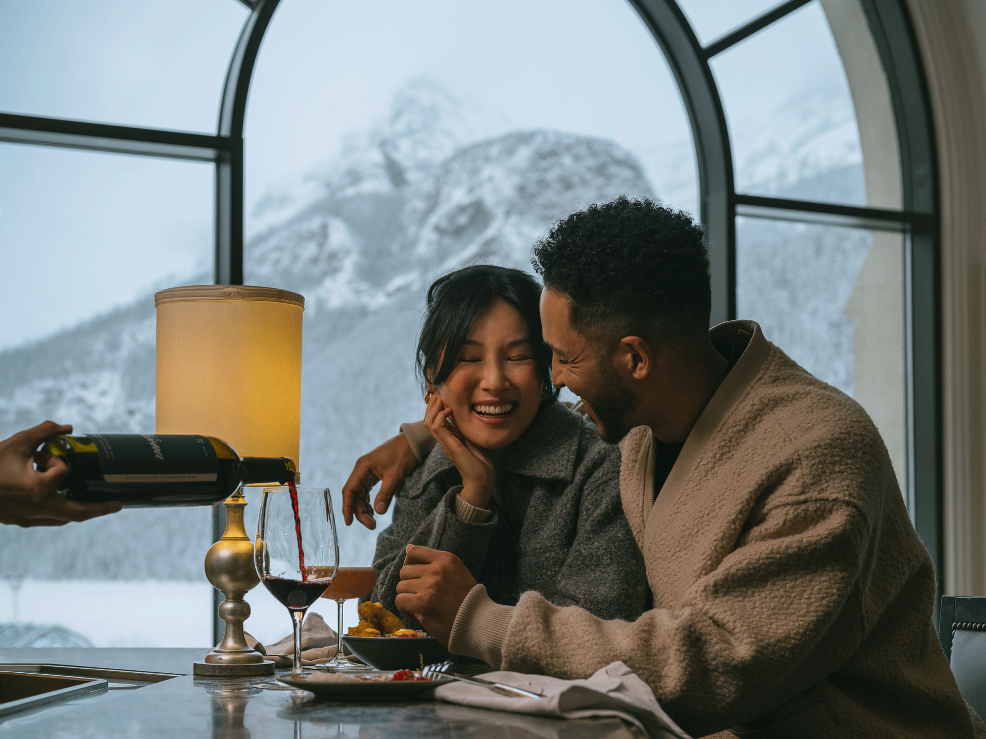 A couple drinking wine at a restaurant in Lake Louise