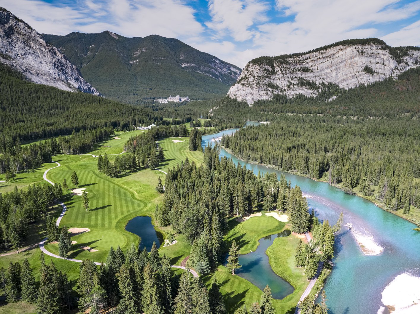 Drone view of the Fairmont Banff Springs Golf course in the mountains