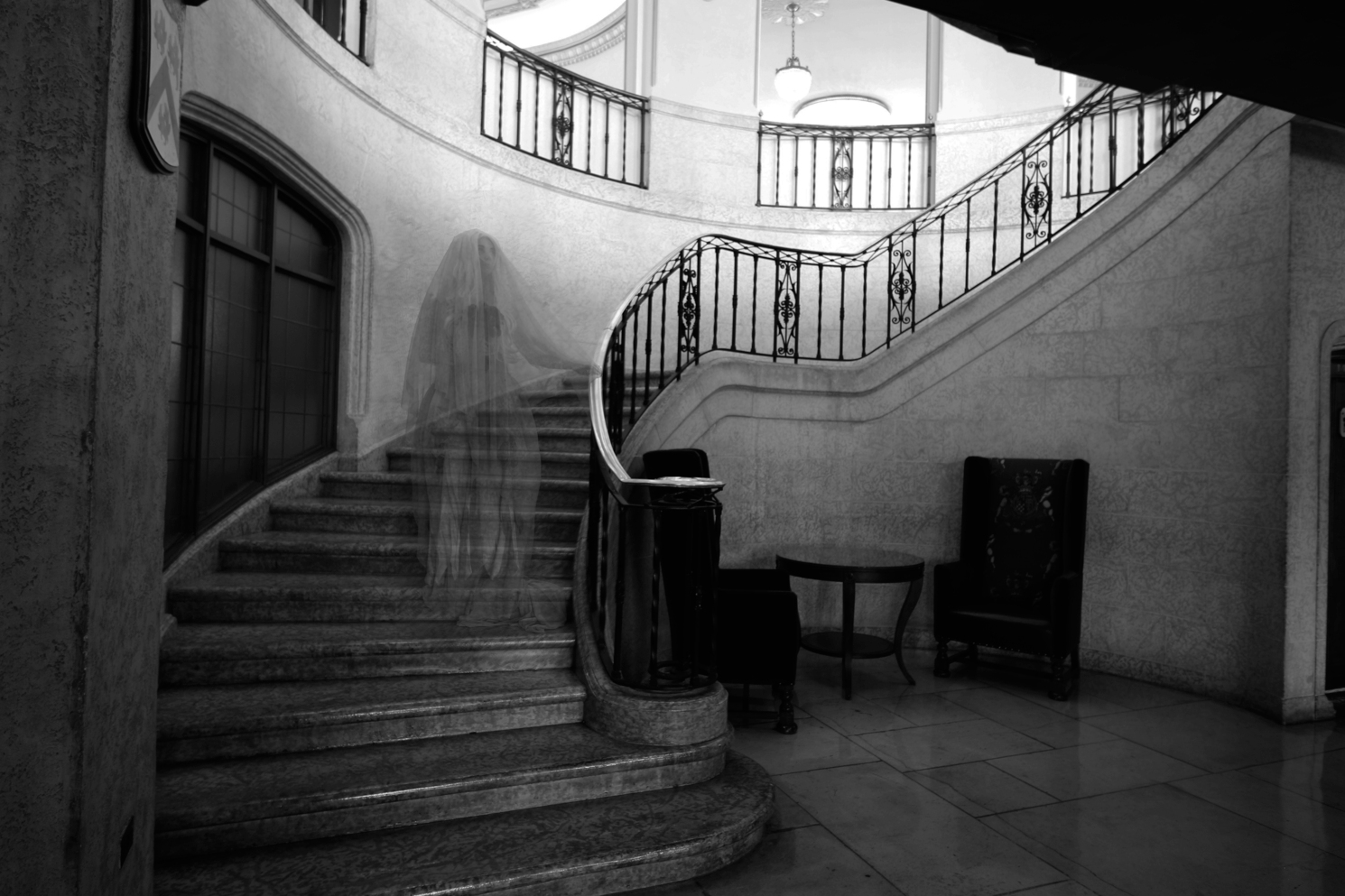 A ghost on the stairs at the Fairmont Banff Springs Castle at Halloween