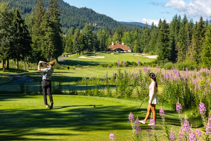 Two golfers on 18 of Chateau Whistler Golf course