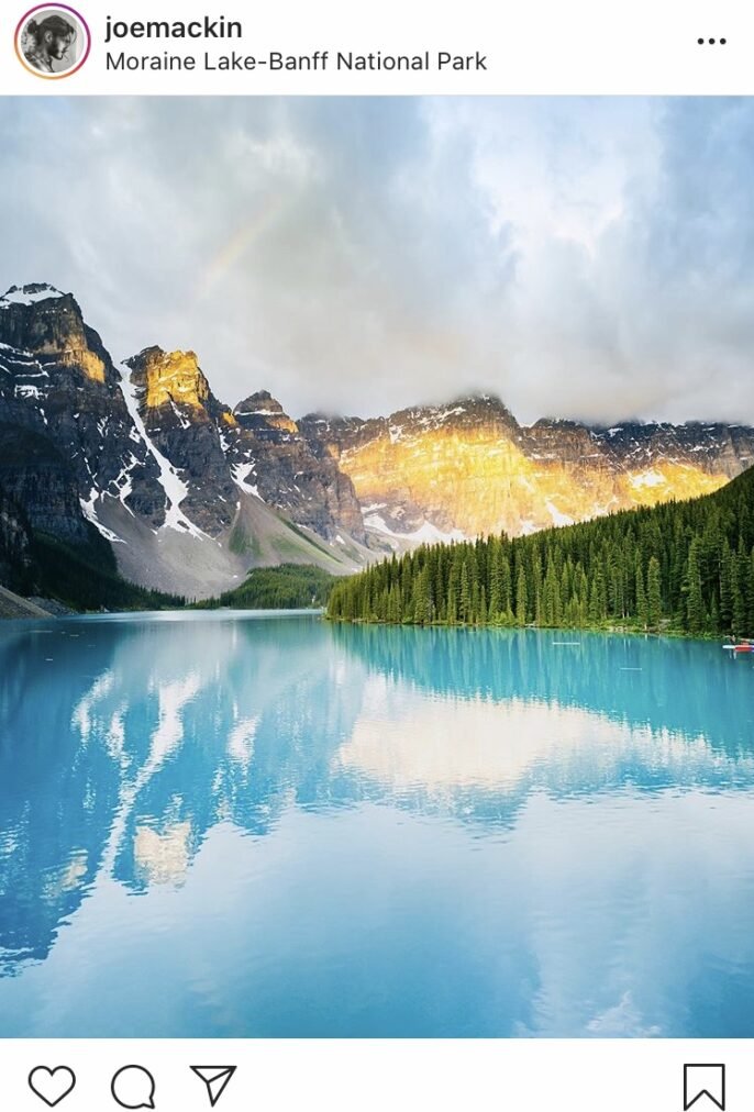 Screenshot Moraine lake showing its turquoise waters and the valley of the ten peaks in the background.