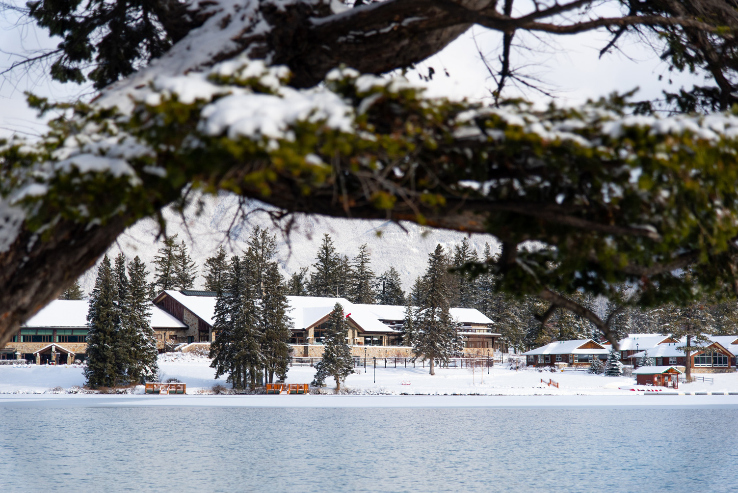 View of Jasper Park lodge from across the lake at Christmas.