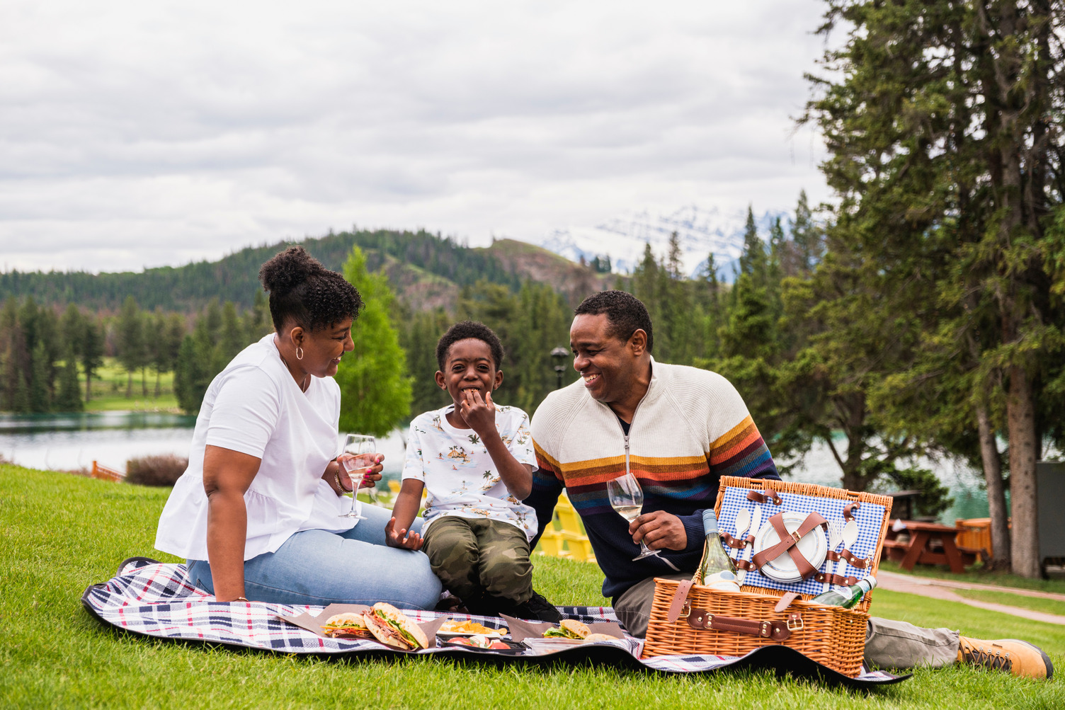 Luxury Picnic - Family 2 A family laughing on the shores of Lac Beauvert while enjoying at picnic