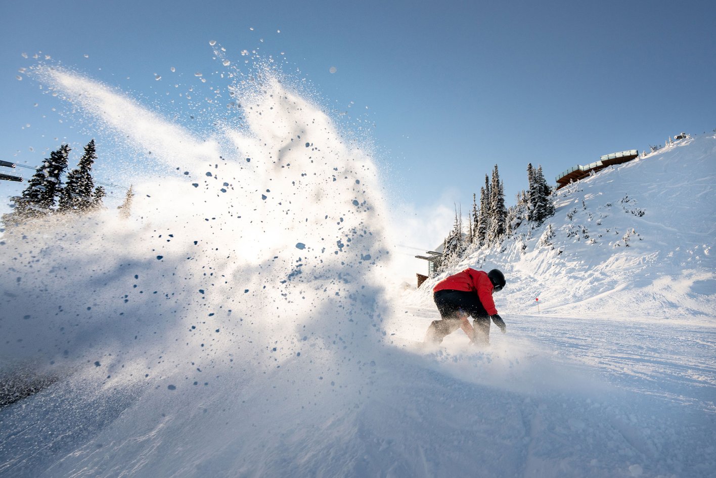Skier playing in the snow in Whistler, Canada. Ski the best of Canada.