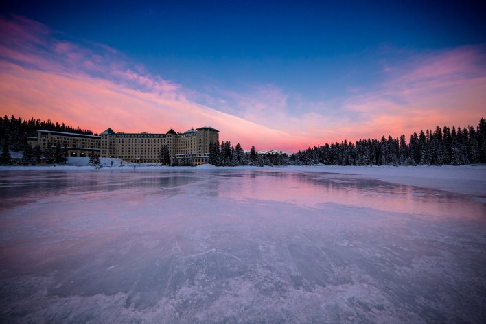Sun setting over the Fairmont Chateau Lake Louise in the winter