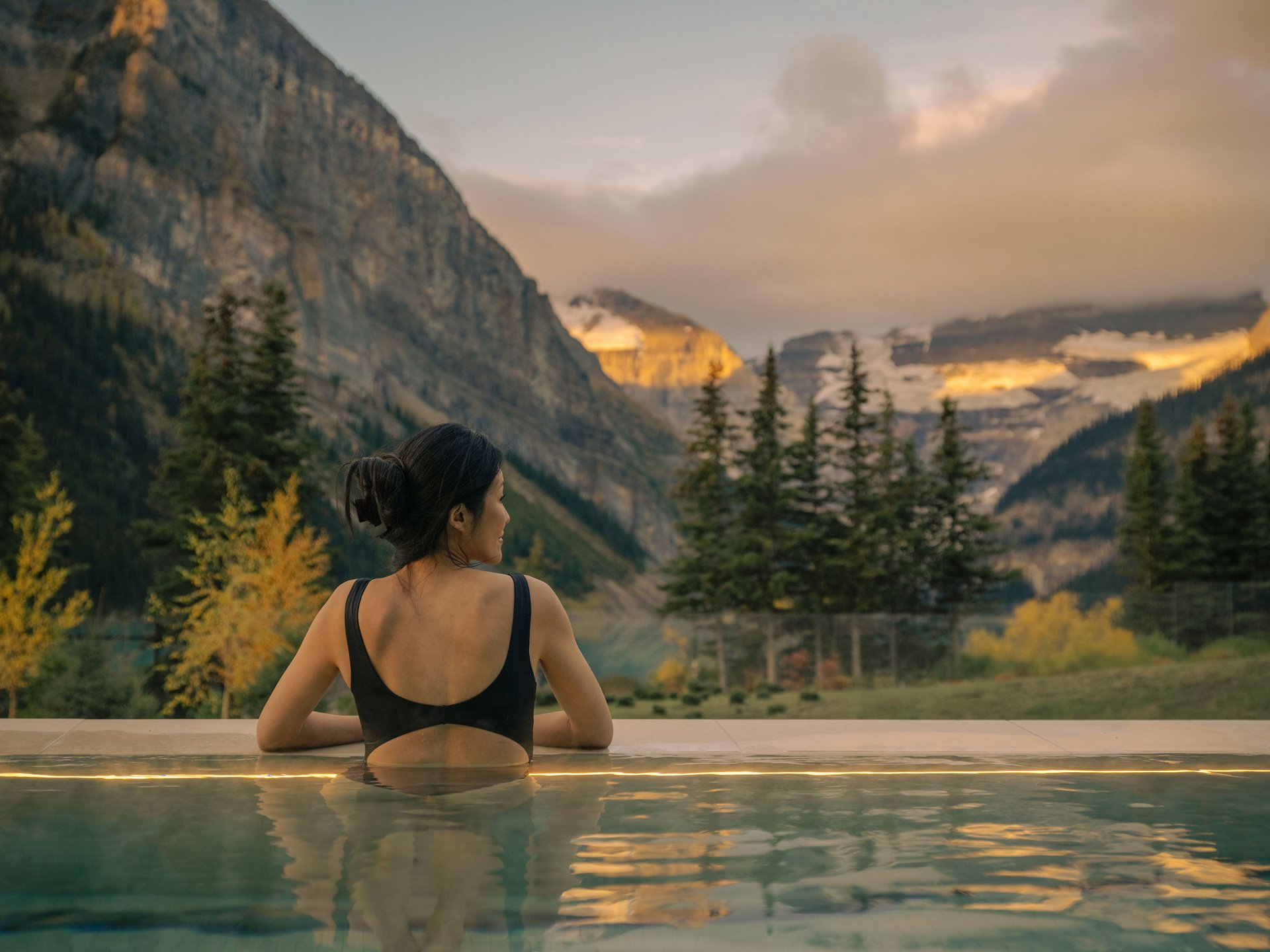 Women looking out from the Chateau Lake Louise wellness facility