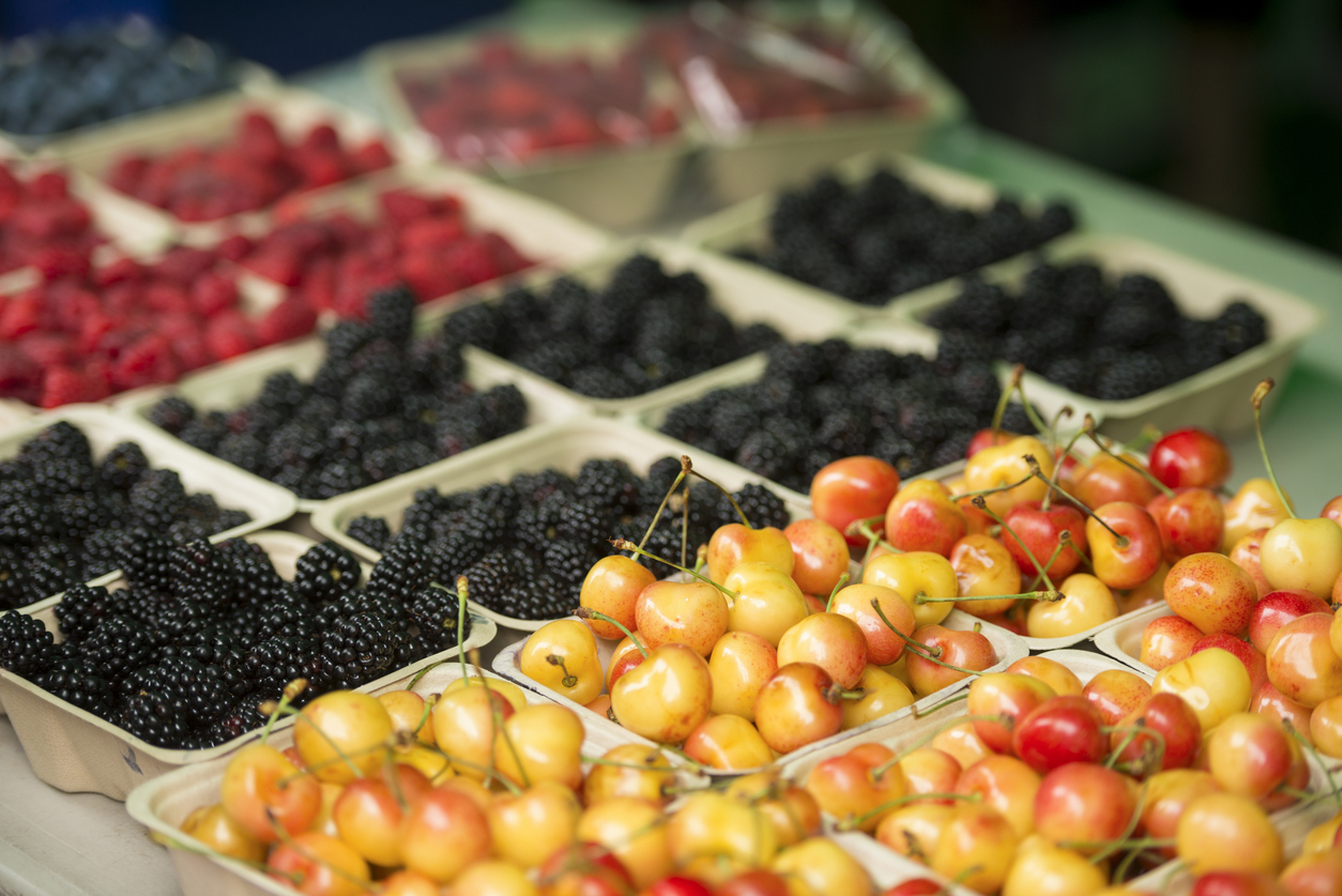 Cherries blackberries and raspberries at a Farmers Market.