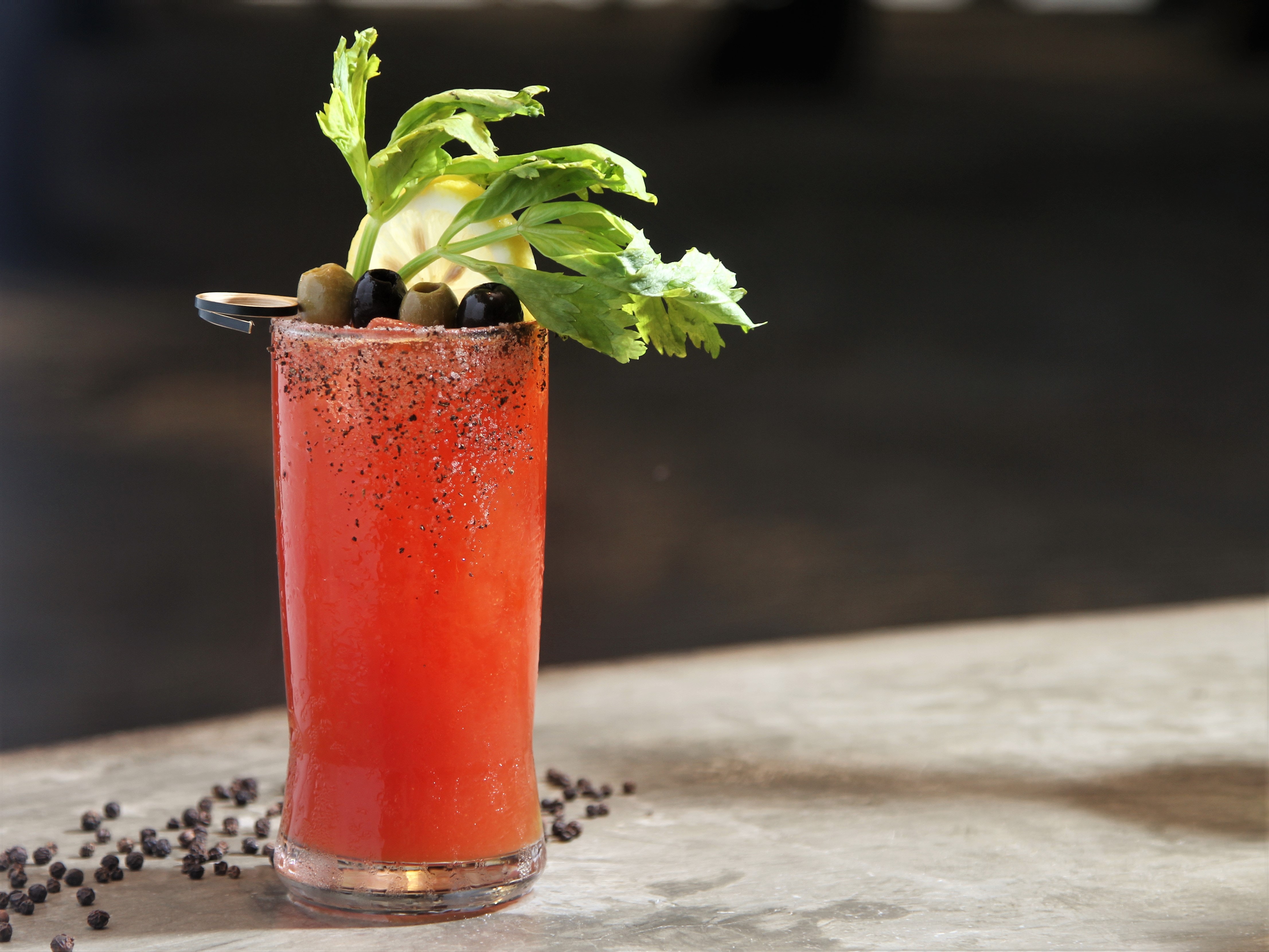 Canadian drink the caesar on a table with celery